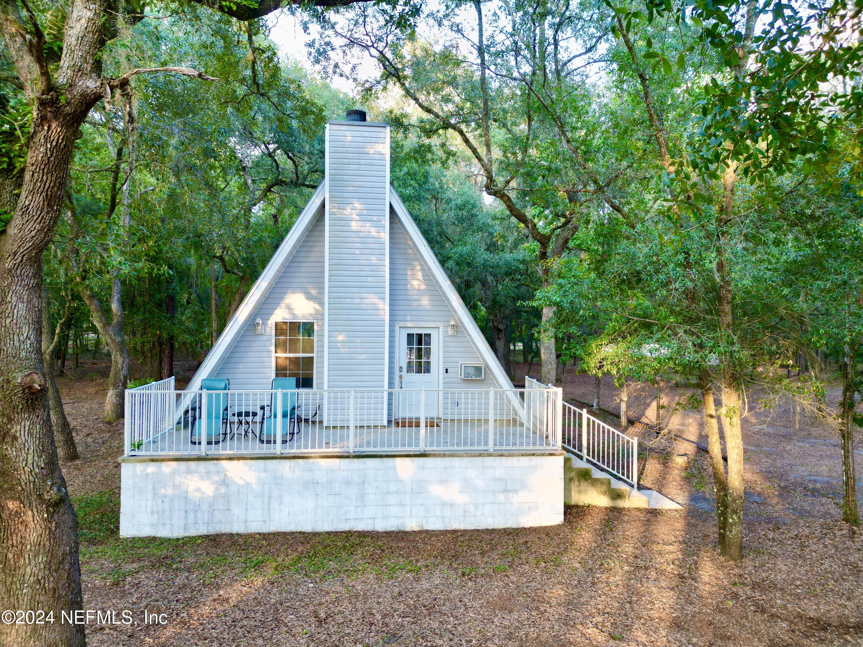 a view of house with a yard