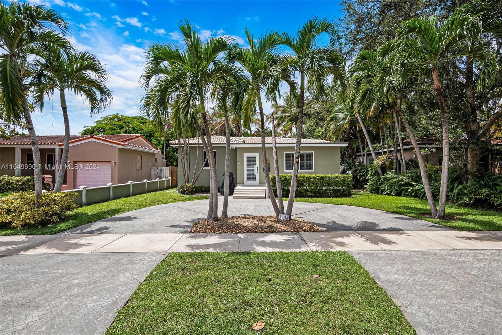 a house with palm tree in front of it