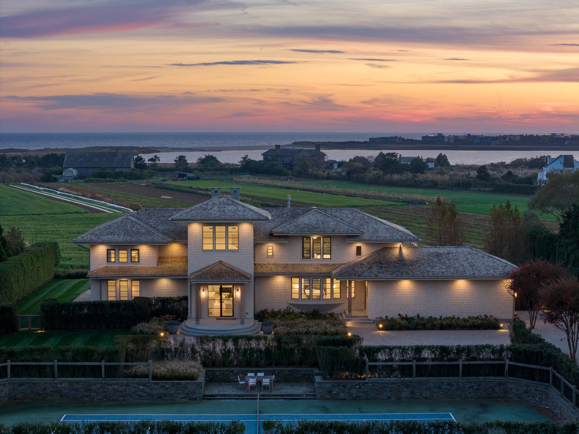 an aerial view of a house with yard swimming pool and outdoor seating