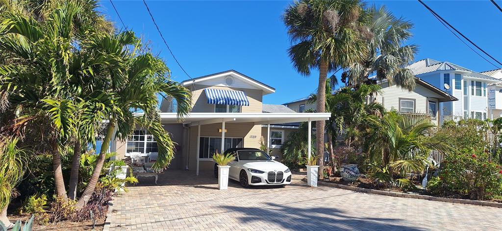 a view of a car parked in front of a house