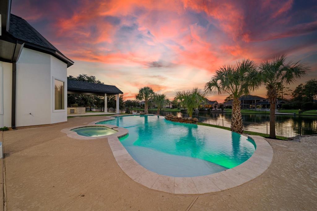 Ready to be thrilled with 15326 Hilltop View Dr. in Rock Creek? Take a peep at the backyard before we step inside. The sparkling pool is surrounded by a spacious deck offering plenty of room lounging and sunbathing. Palm trees adds to the resort-like ambiance. Covered patio area provides shaded seating, making it an ideal spot for outdoor dining or just enjoying the view.