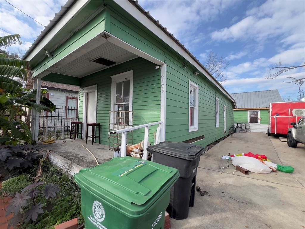 a view of a backyard with furniture and a garage