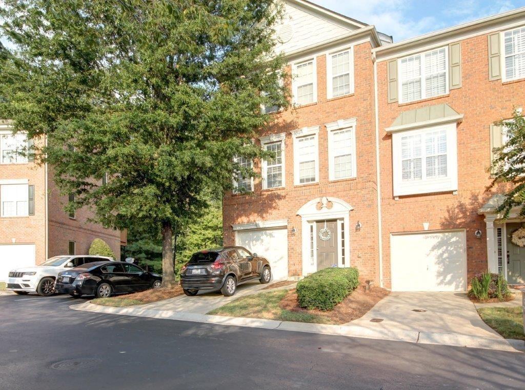 a view of a parked cars in front of a building