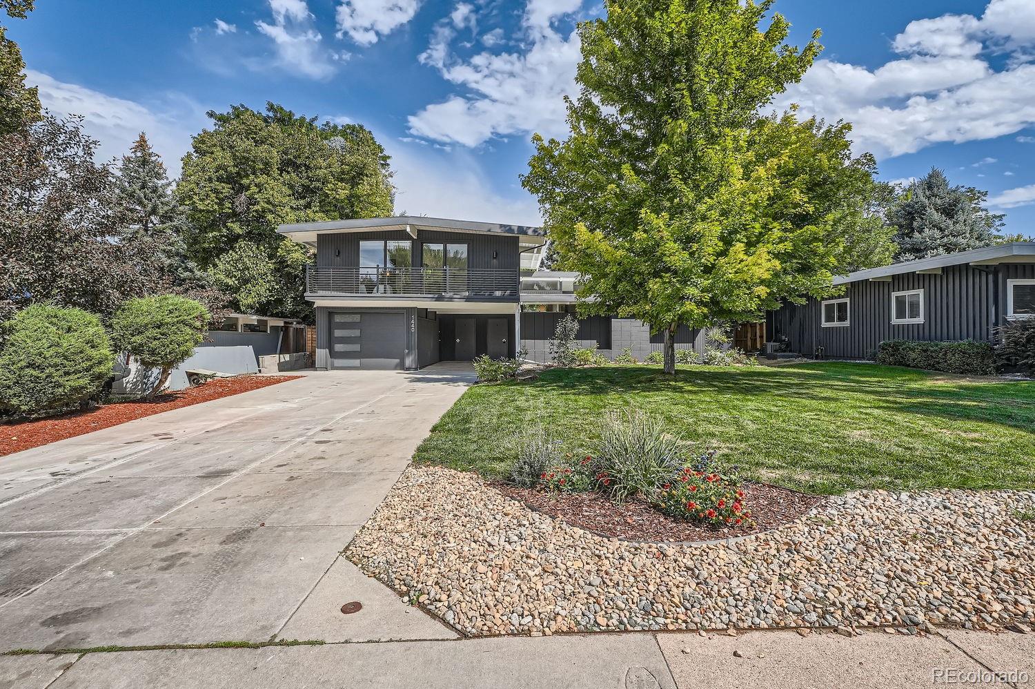 a view of house with yard