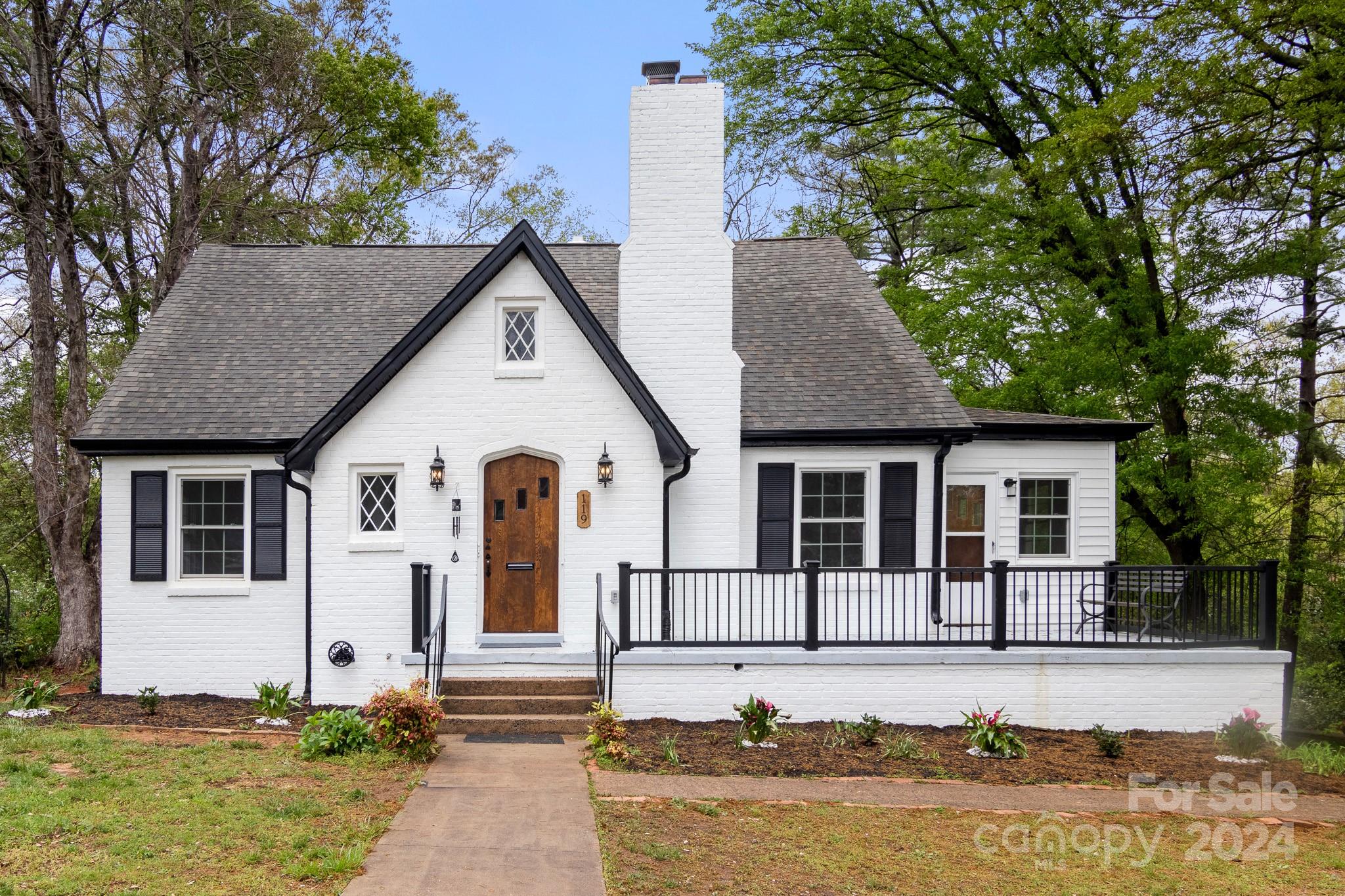 a front view of a house with garden