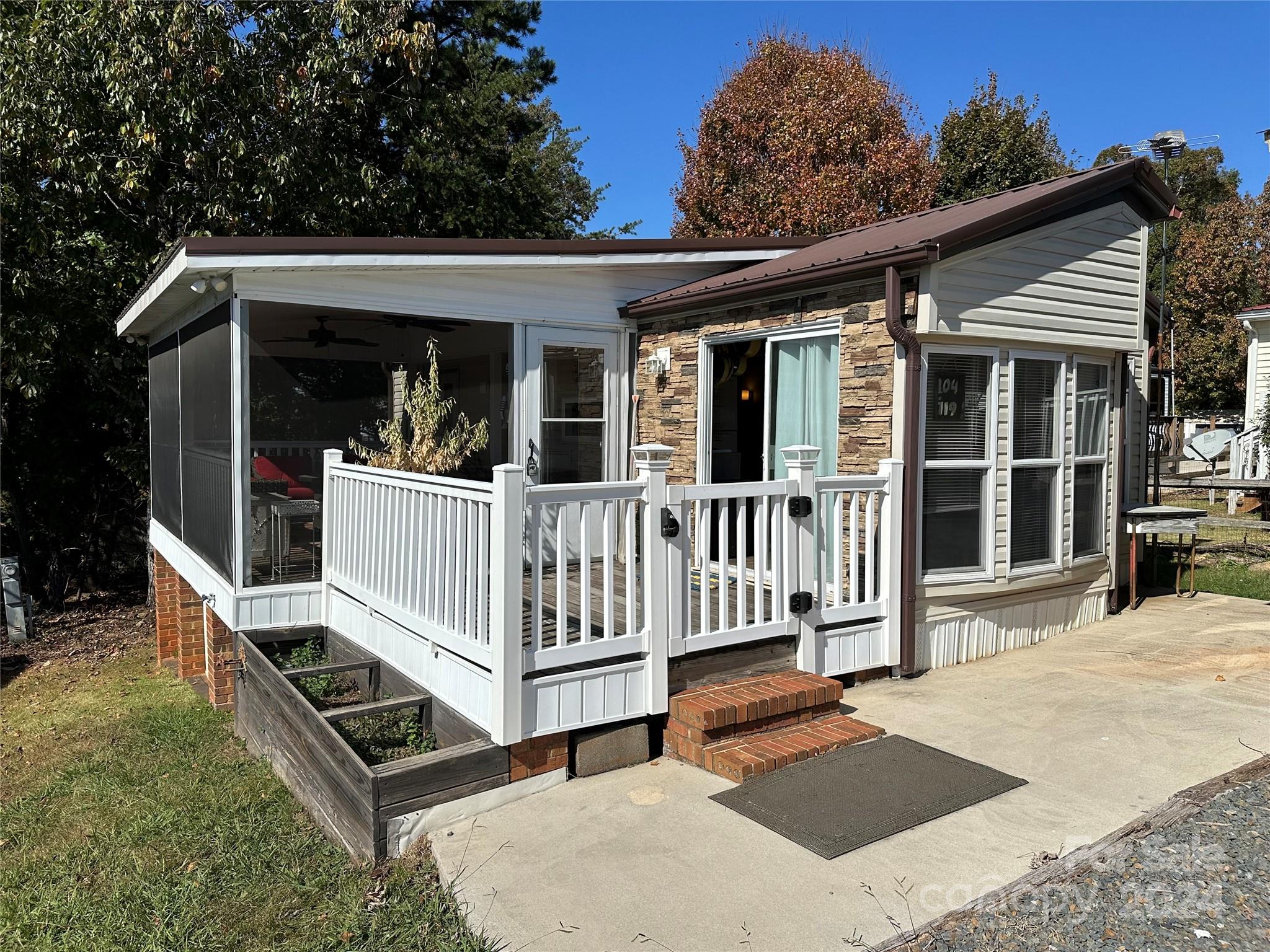 a view of a house with backyard and porch