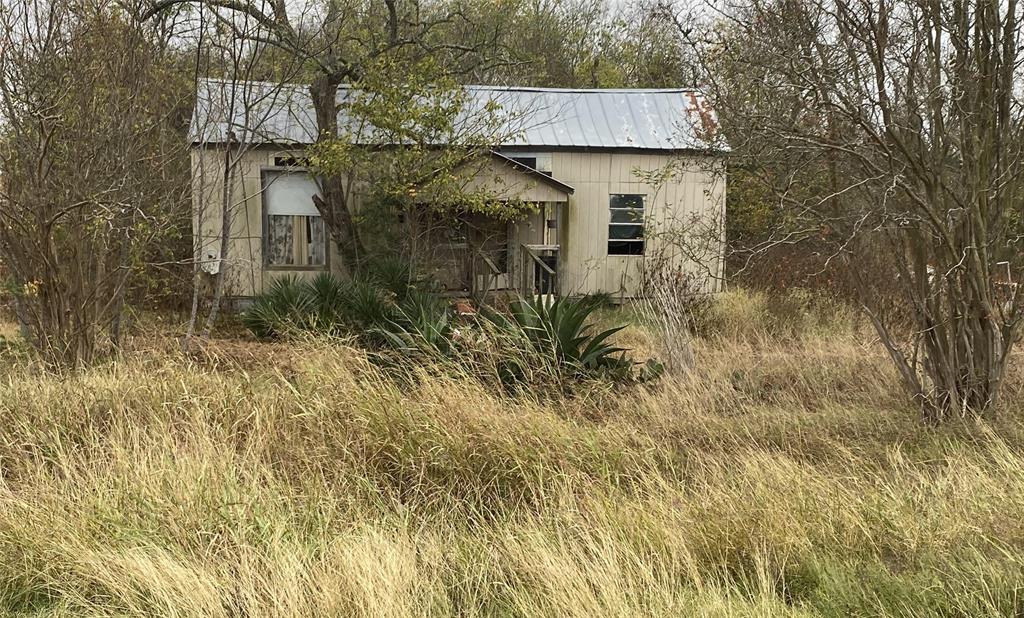 a view of a house with a tree