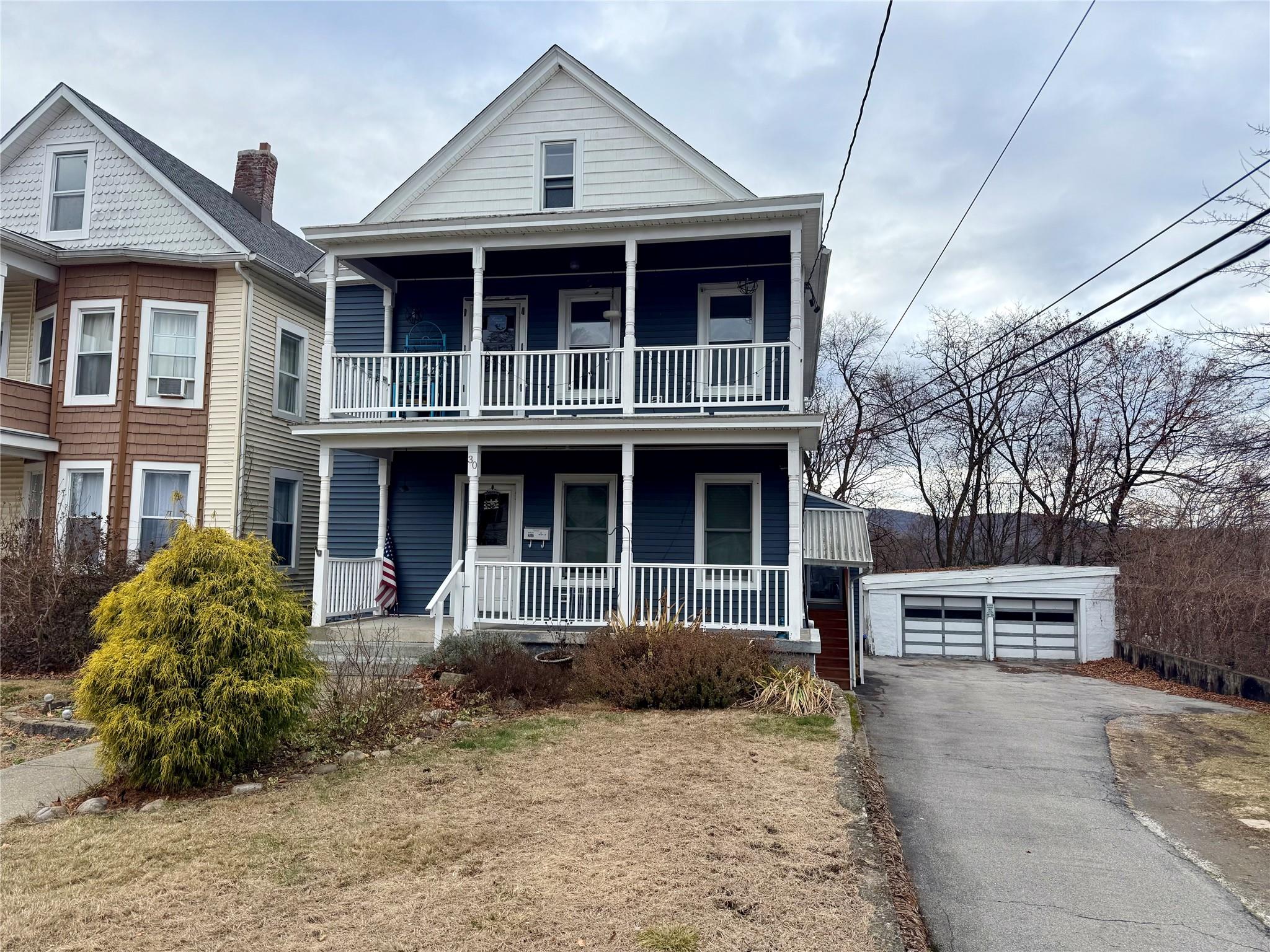 a view of a house with a yard