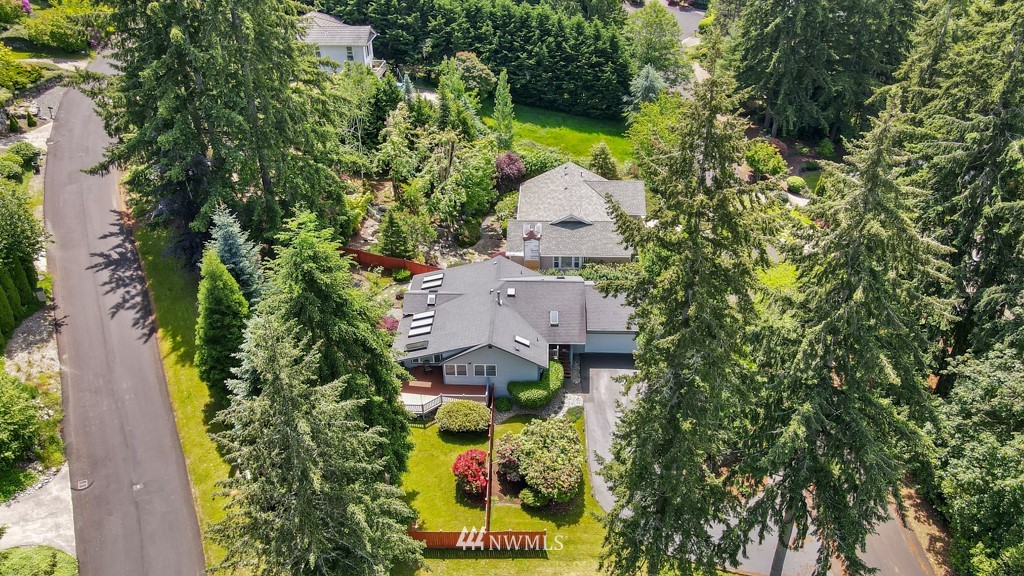 an aerial view of a house with a yard and garden