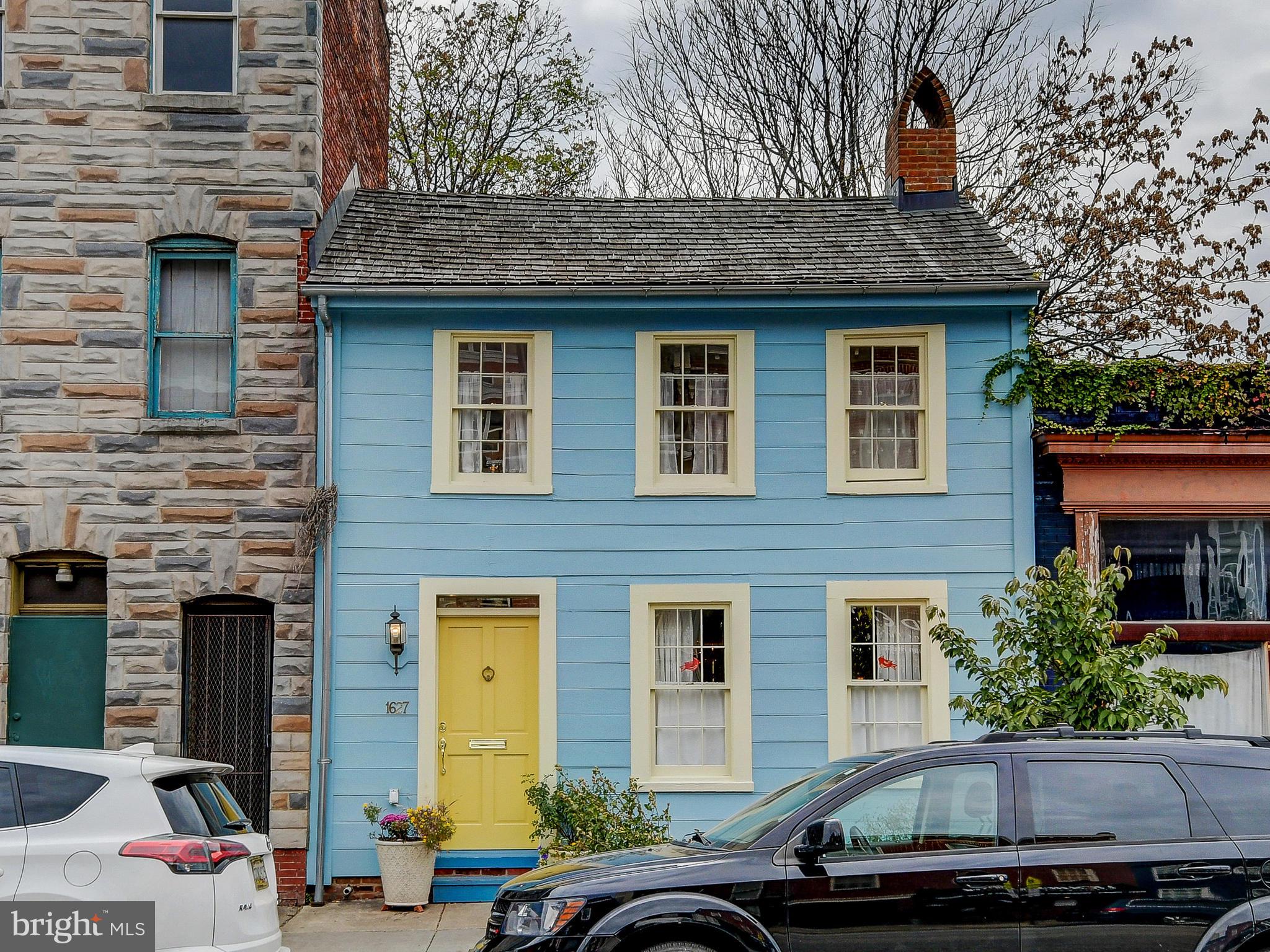 a front view of a house with parking