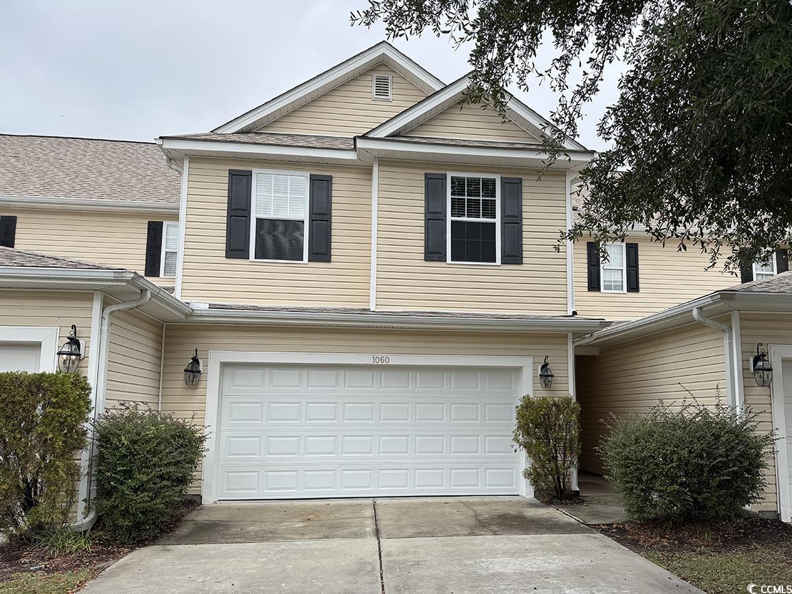 View of front facade with a garage