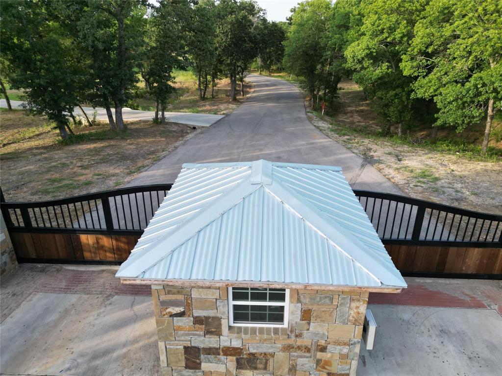 a view of backyard with deck and outdoor seating