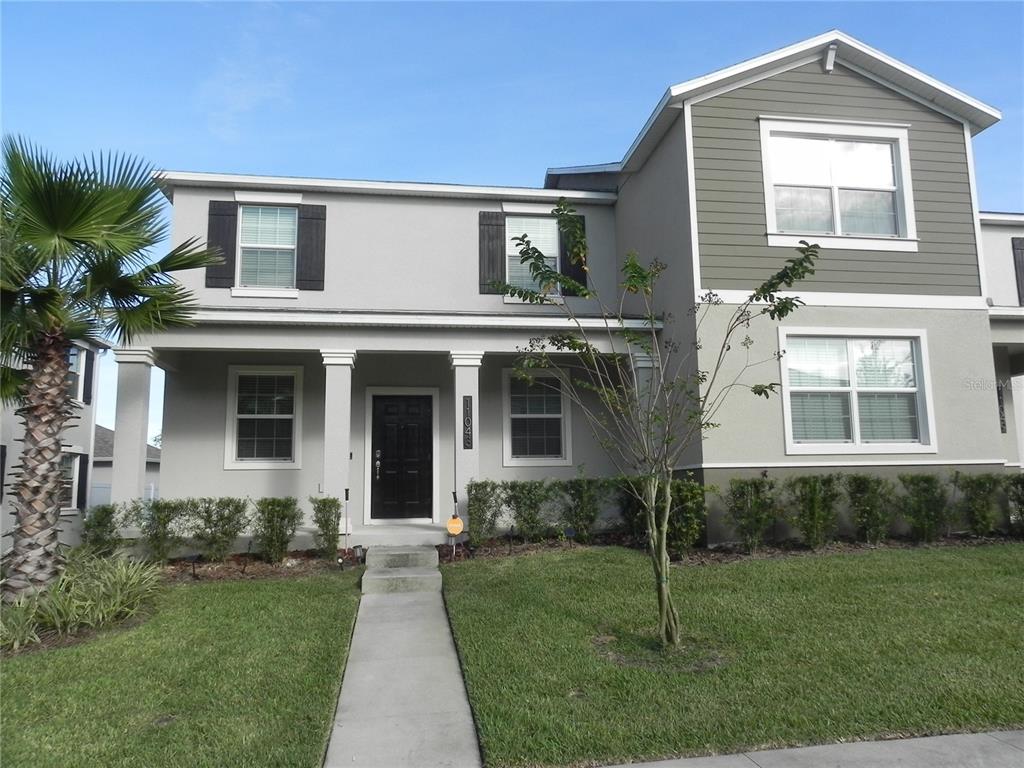 a front view of a house with a yard