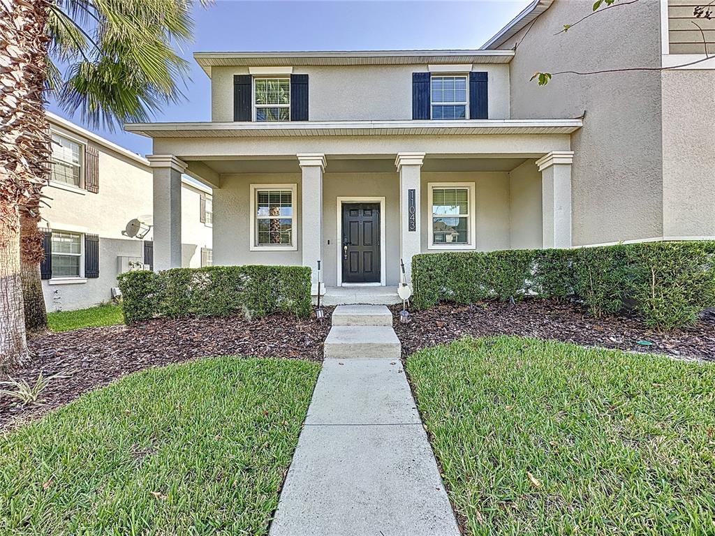 front view of a house with a yard