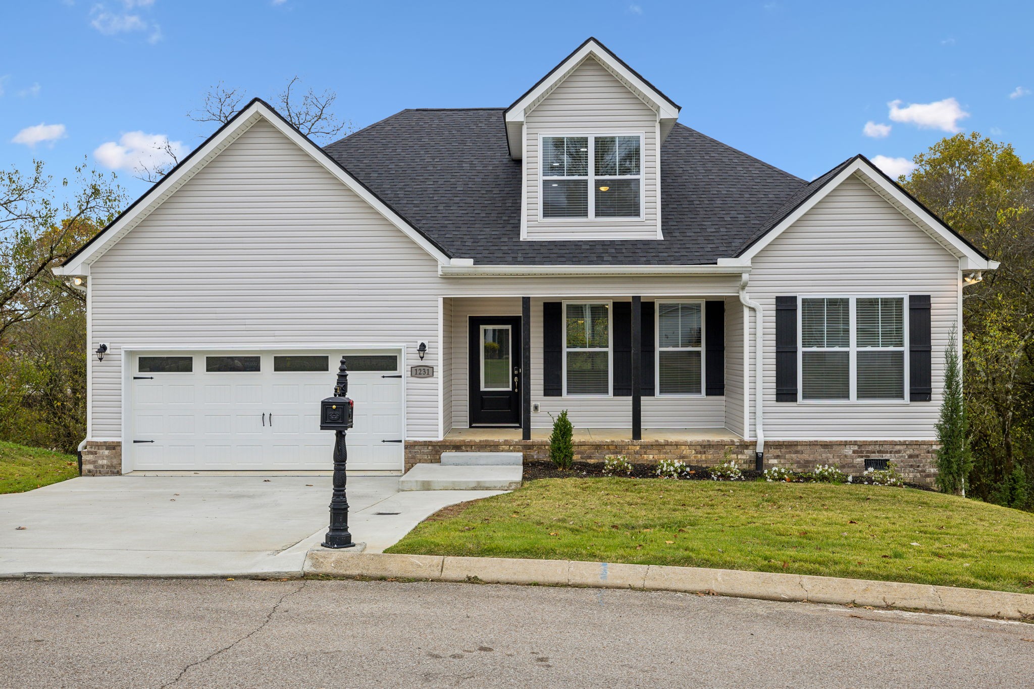 a front view of a house with a yard