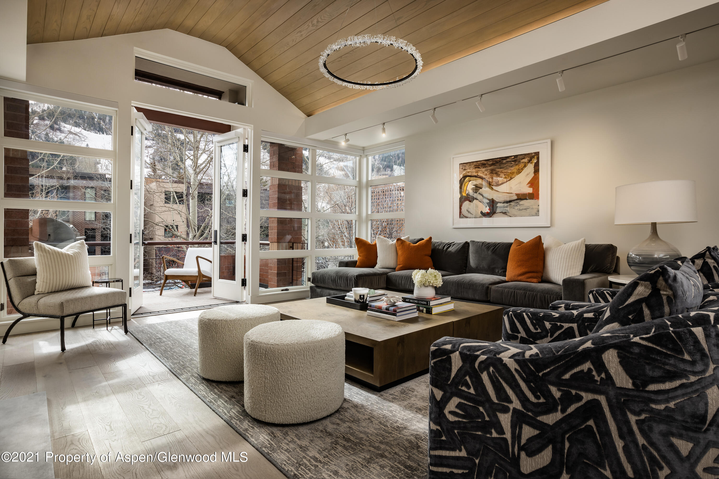 a very nice looking living room with furniture and a large window