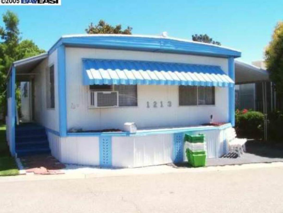 a front view of a house with outdoor space