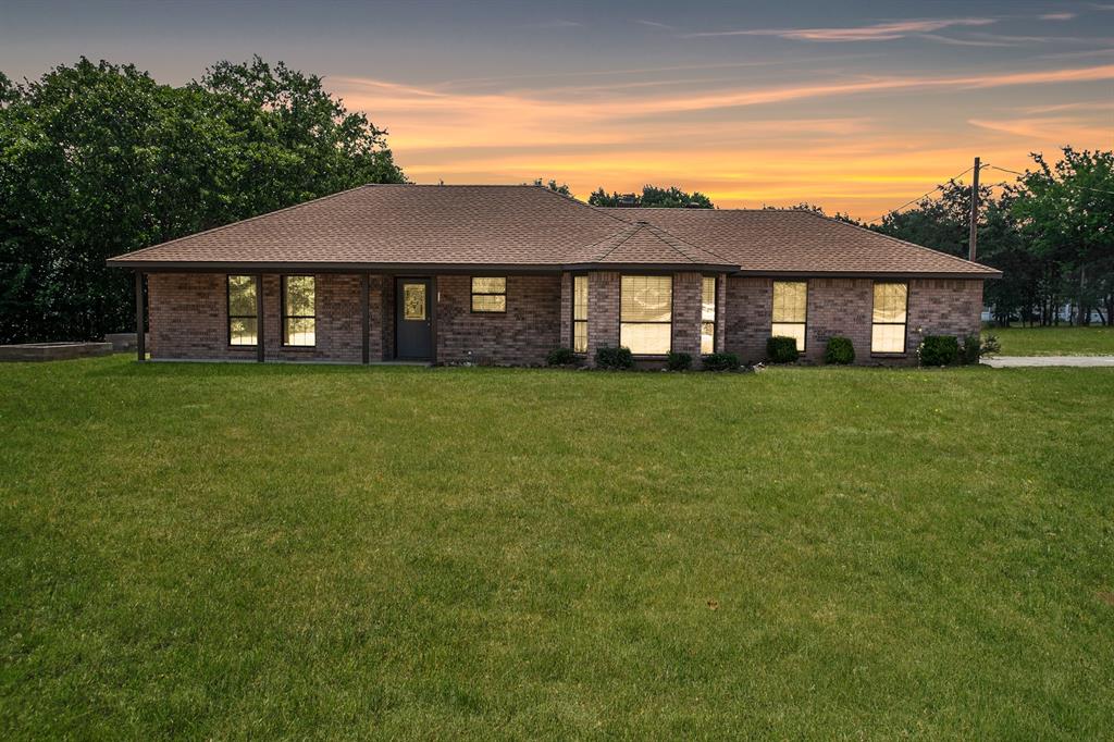 a view of a house with a big yard