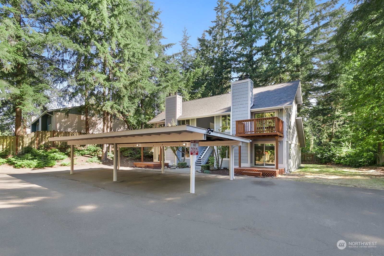 a view of a house with a porch and sitting area