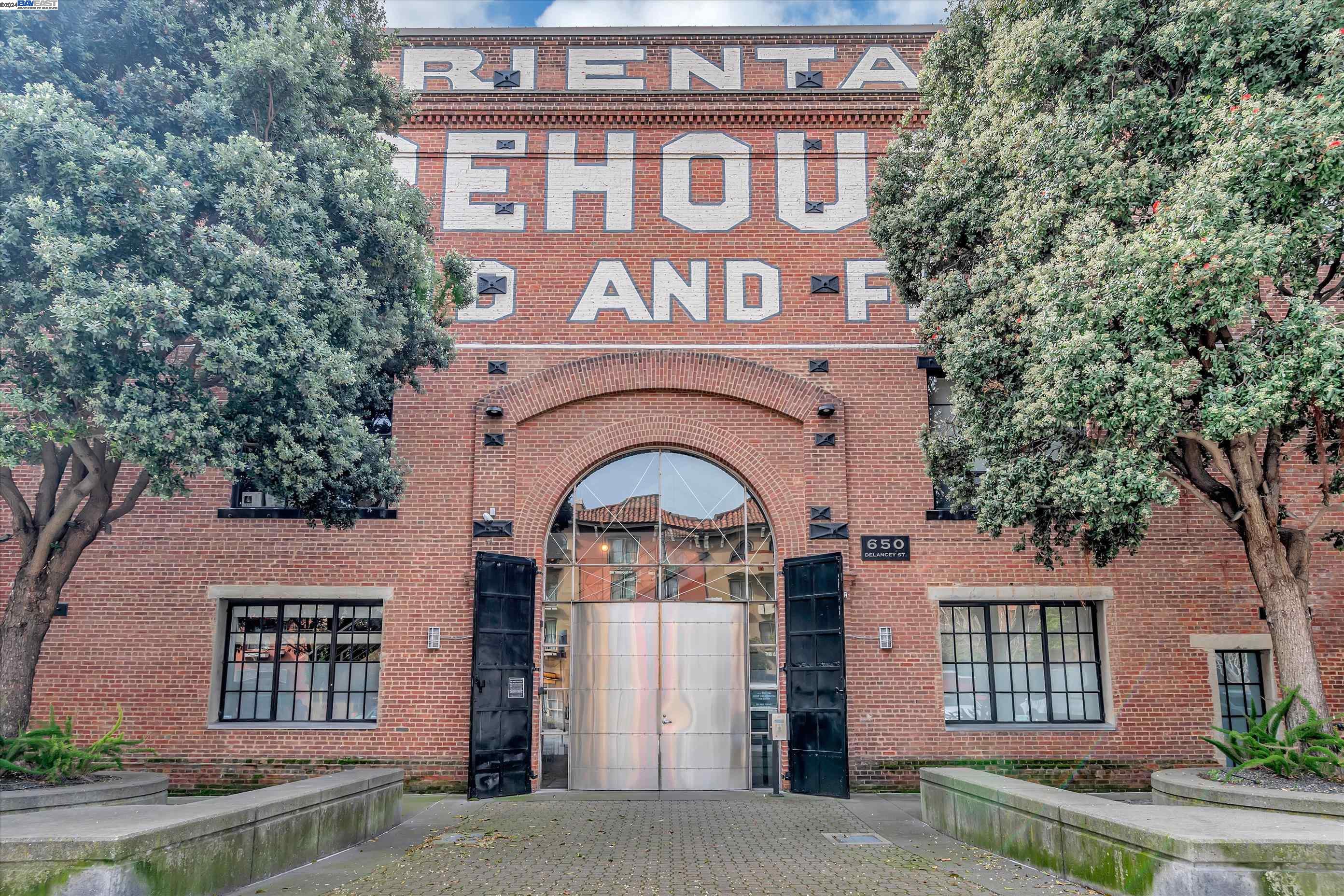 a front view of a building with garden