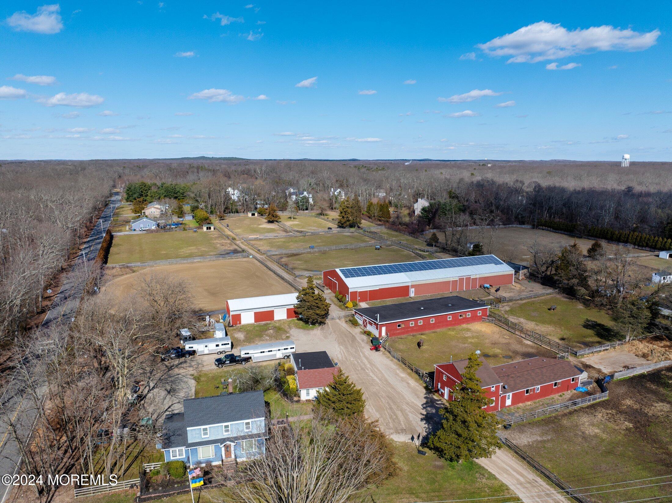 an aerial view of a houses with city view