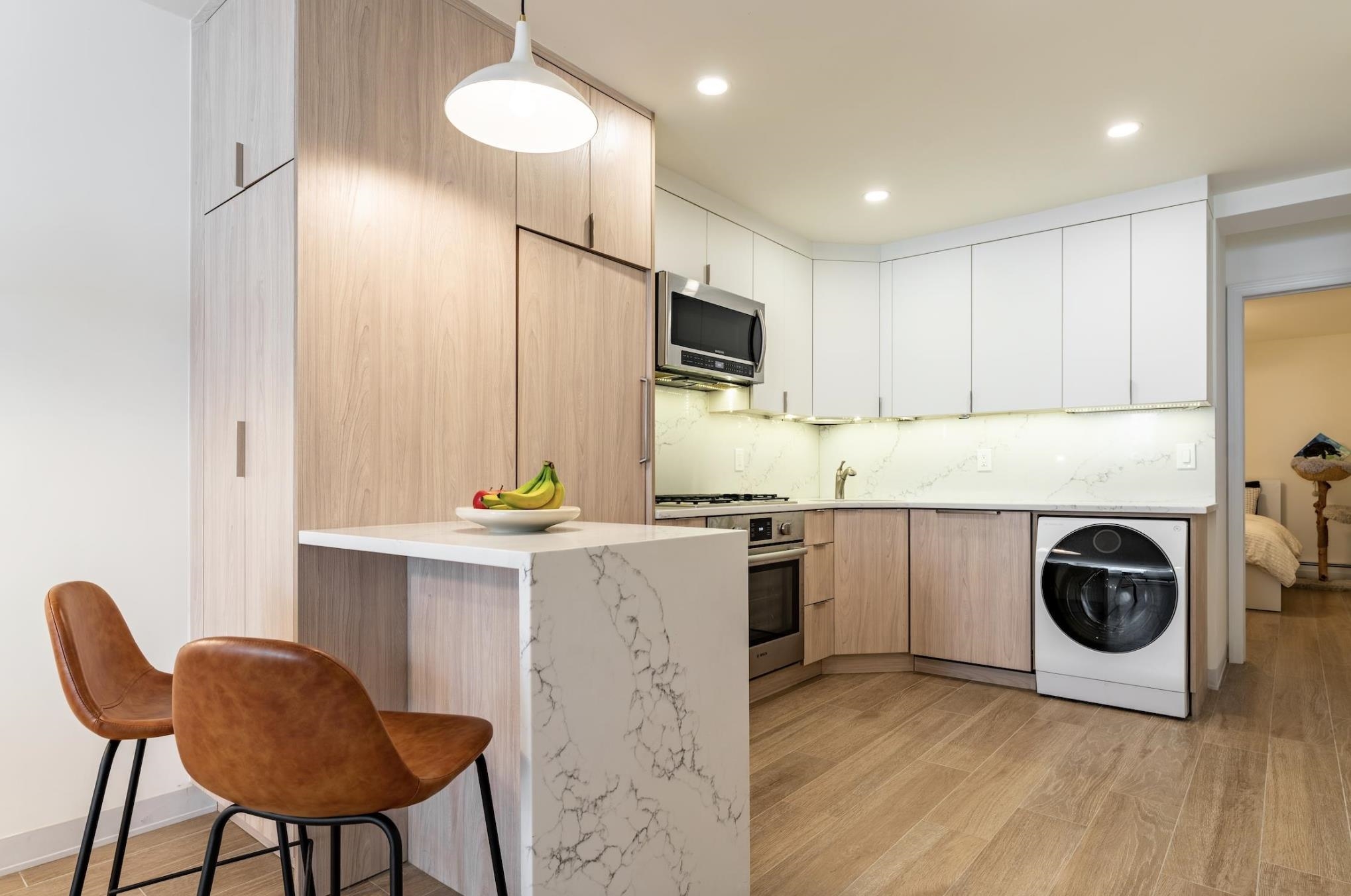 a kitchen with a stove a refrigerator and a refrigerator