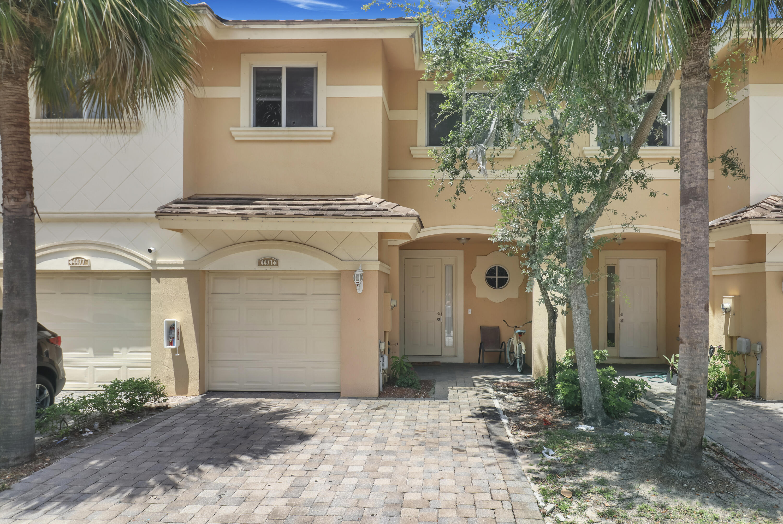 a front view of a house with yard