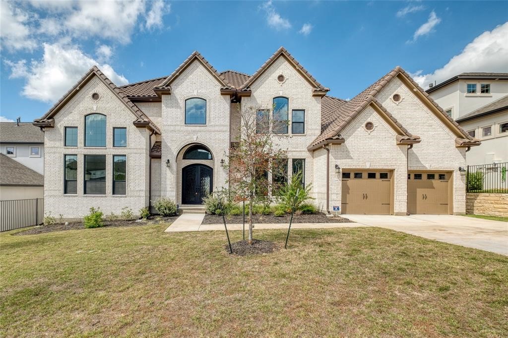 a front view of a house with a yard