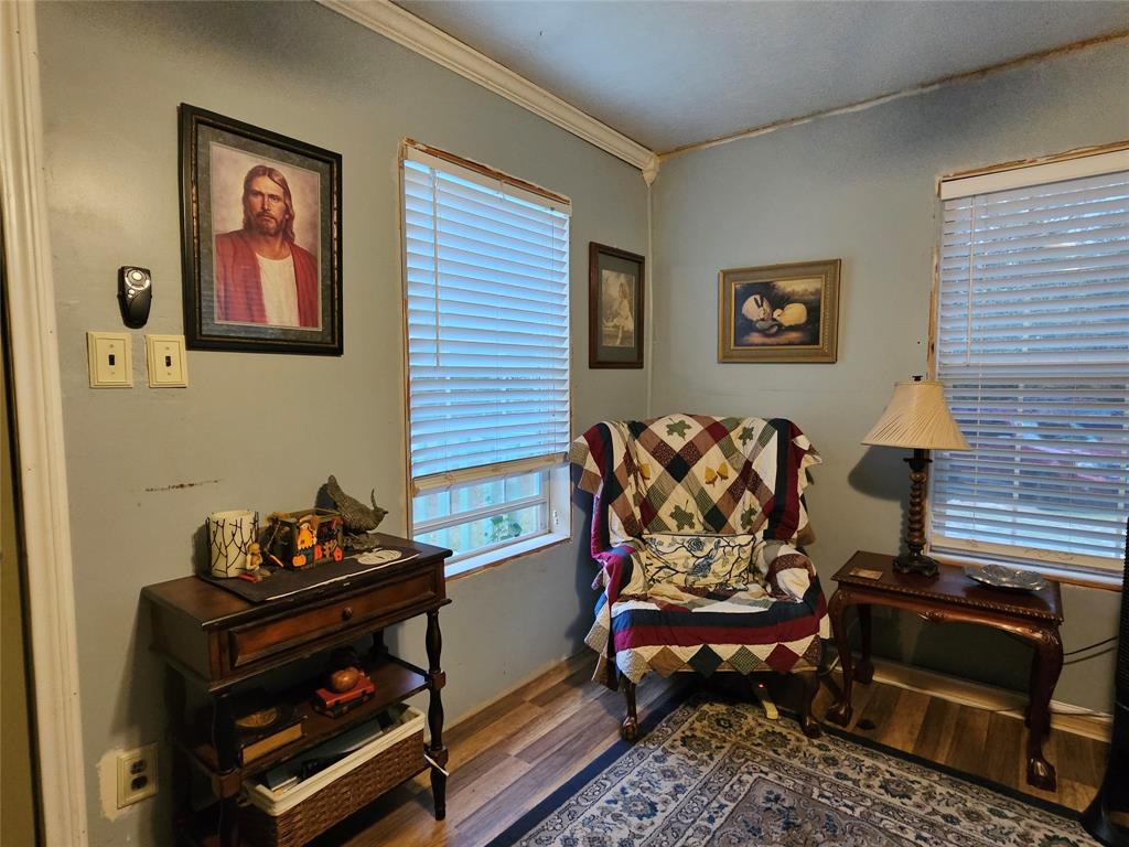 a living room with a couch and a bookshelf