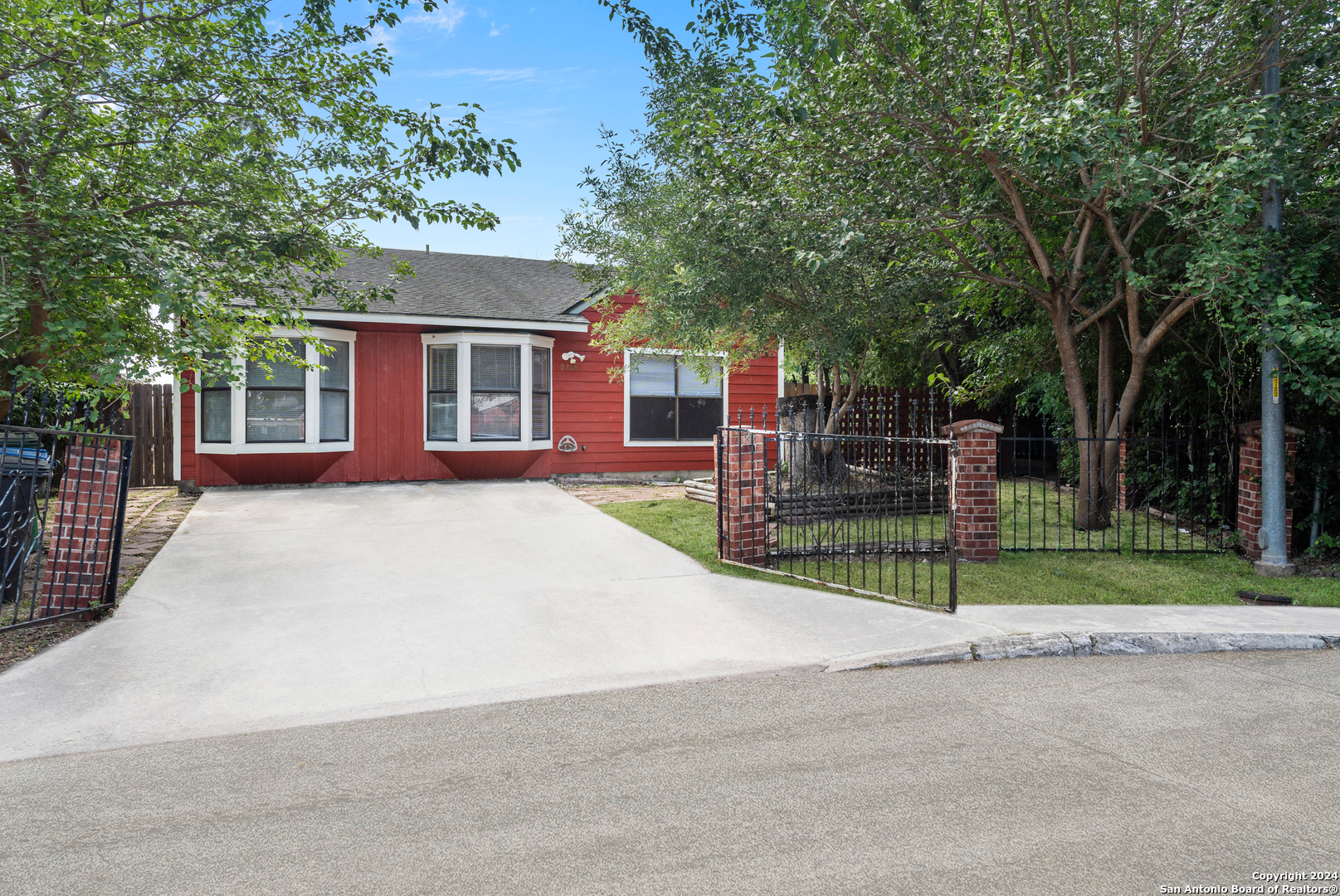 front view of a house with a yard