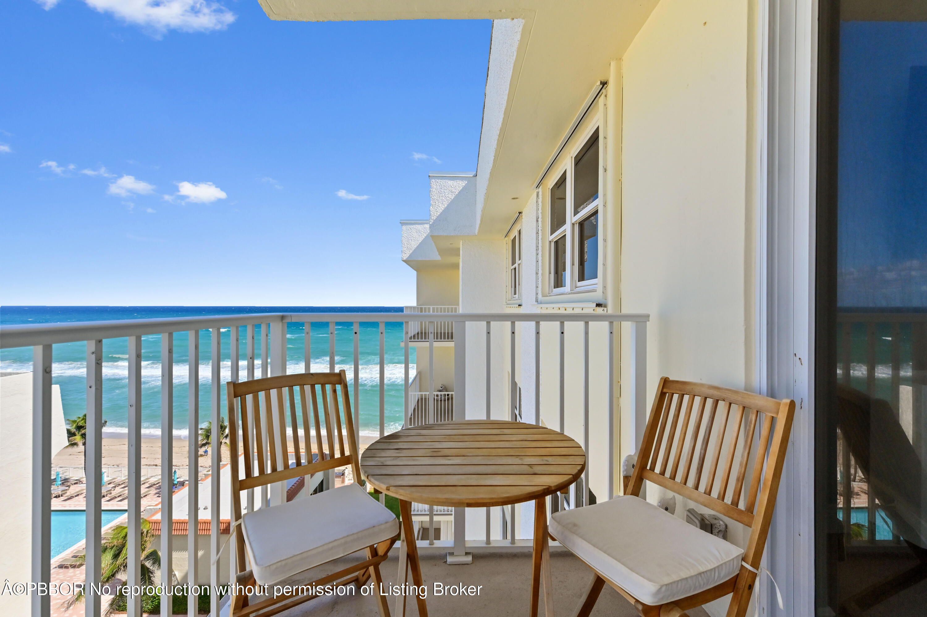 a view of a balcony with furniture