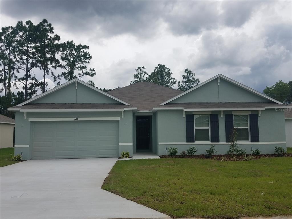 front view of house with a yard