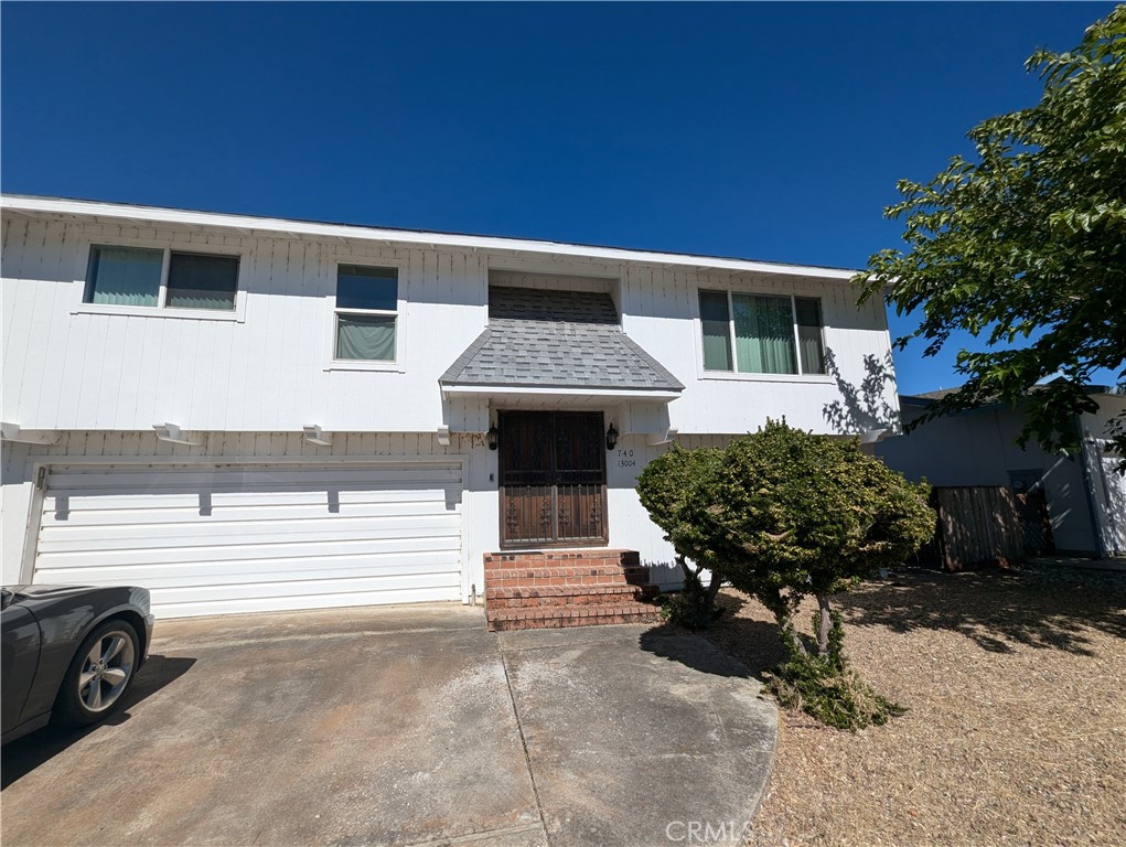 a front view of a house with a garage