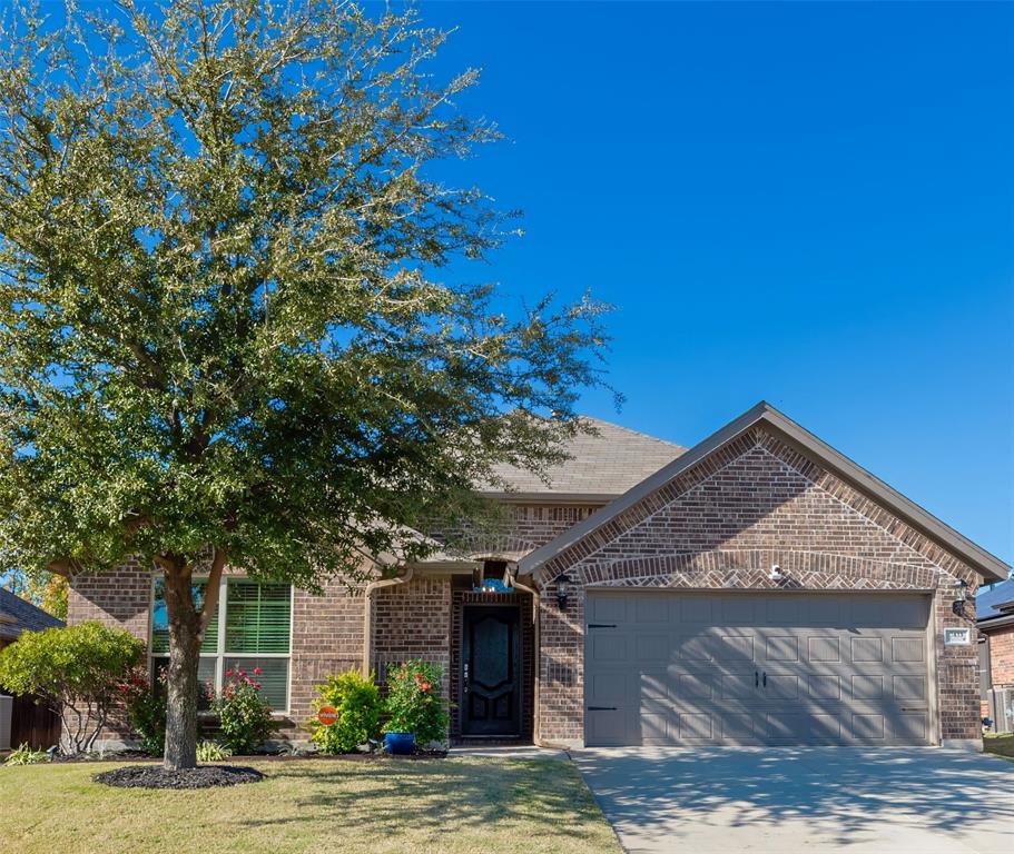 a view of a house with a tree