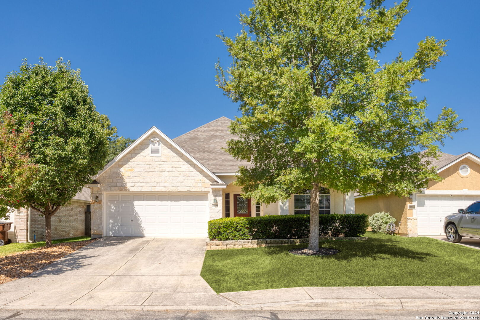 a front view of a house with garden