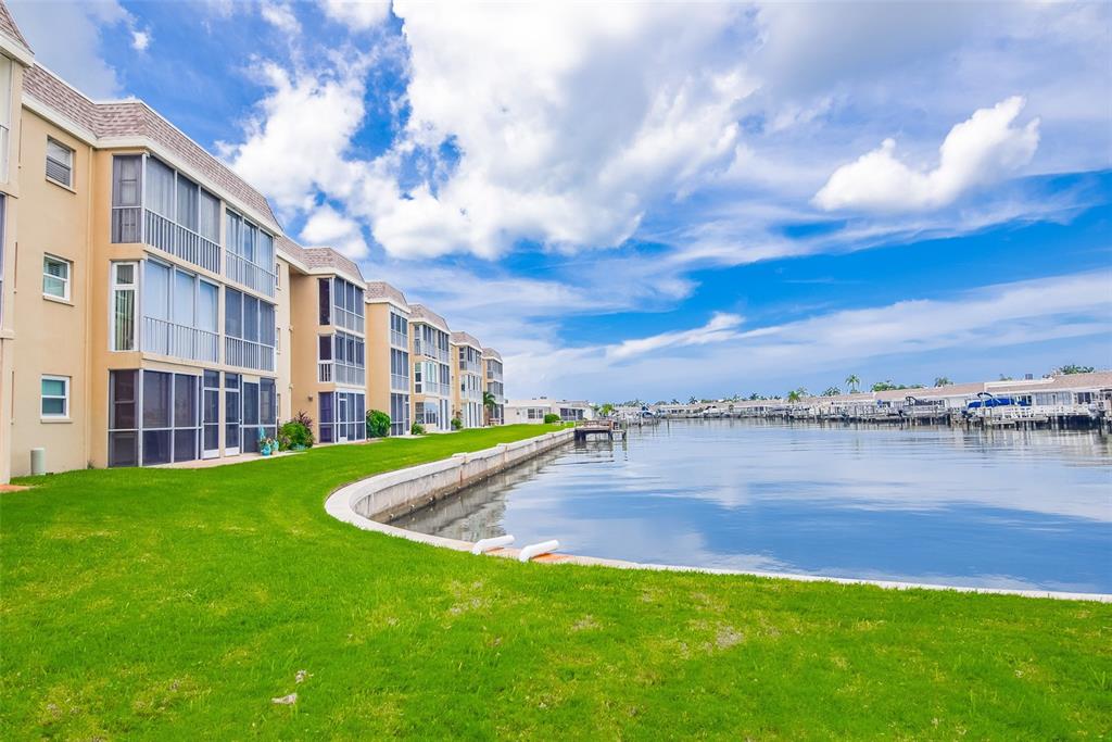 a view of a lake with a big yard