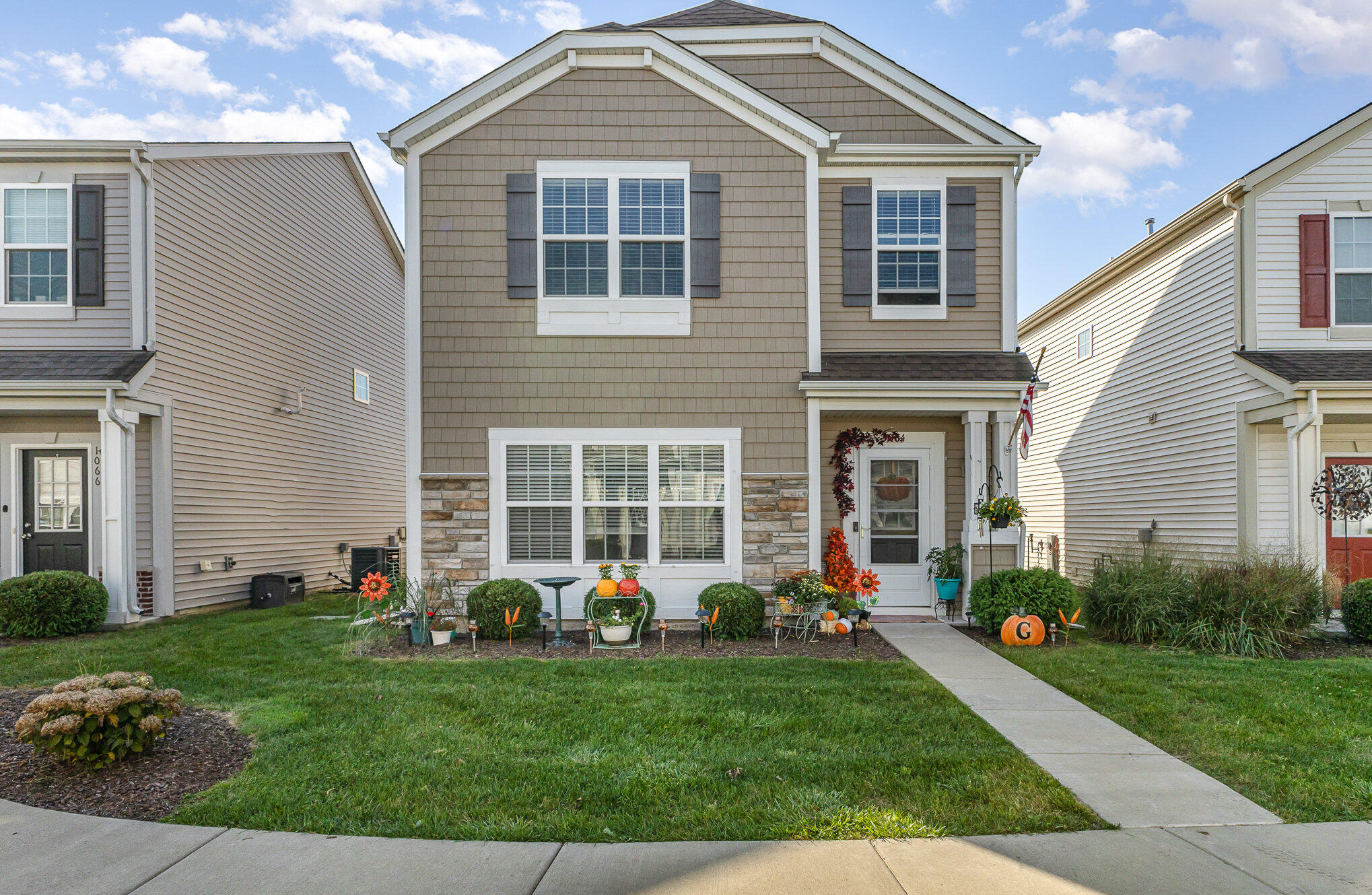 a front view of house with yard and outdoor seating