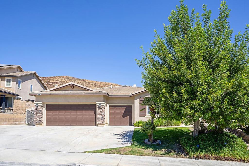 front view of a house with a small yard