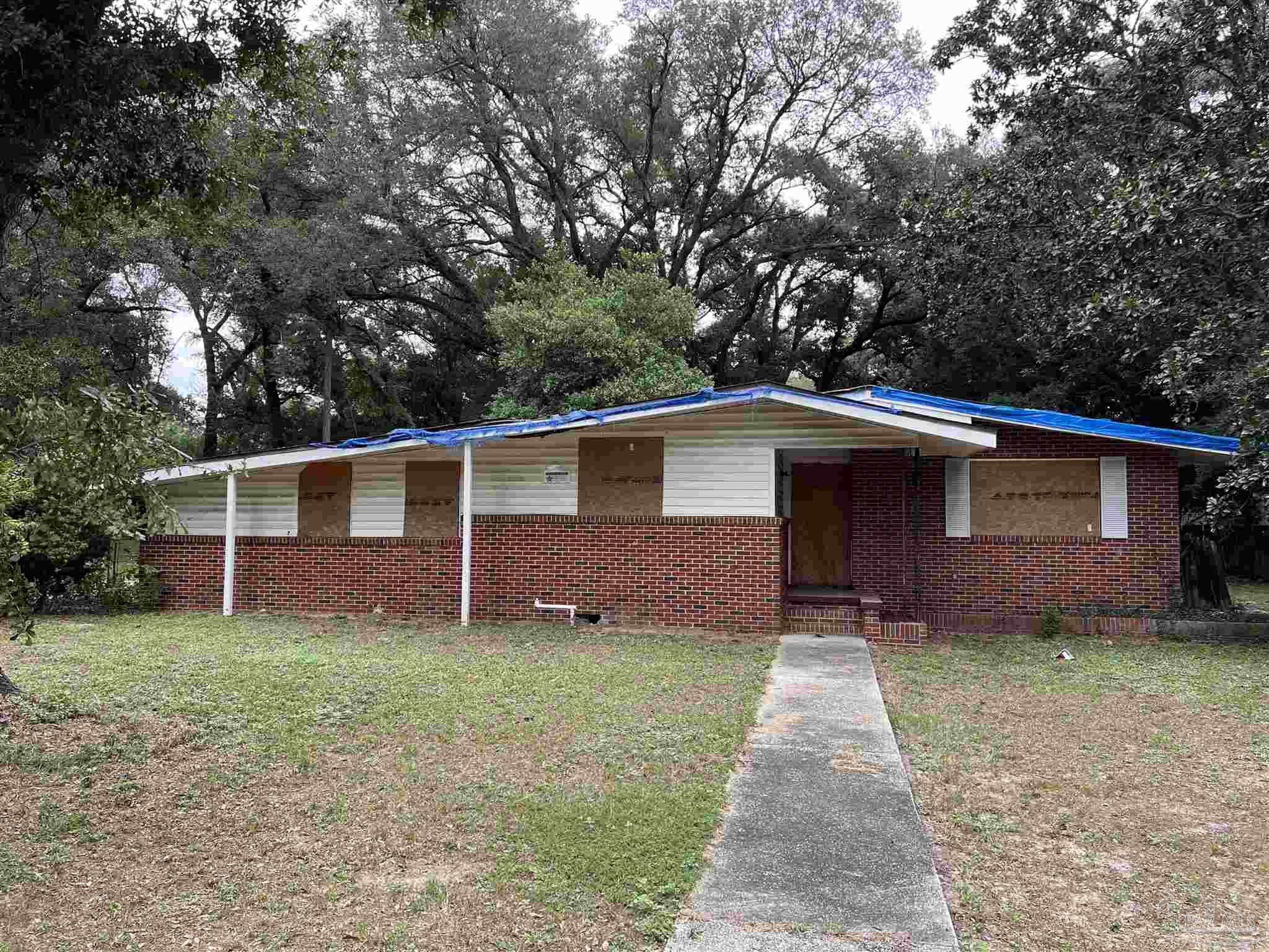 front view of a house with a yard