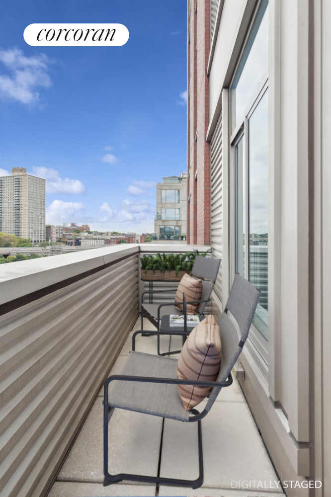 a view of a chairs and table in a balcony