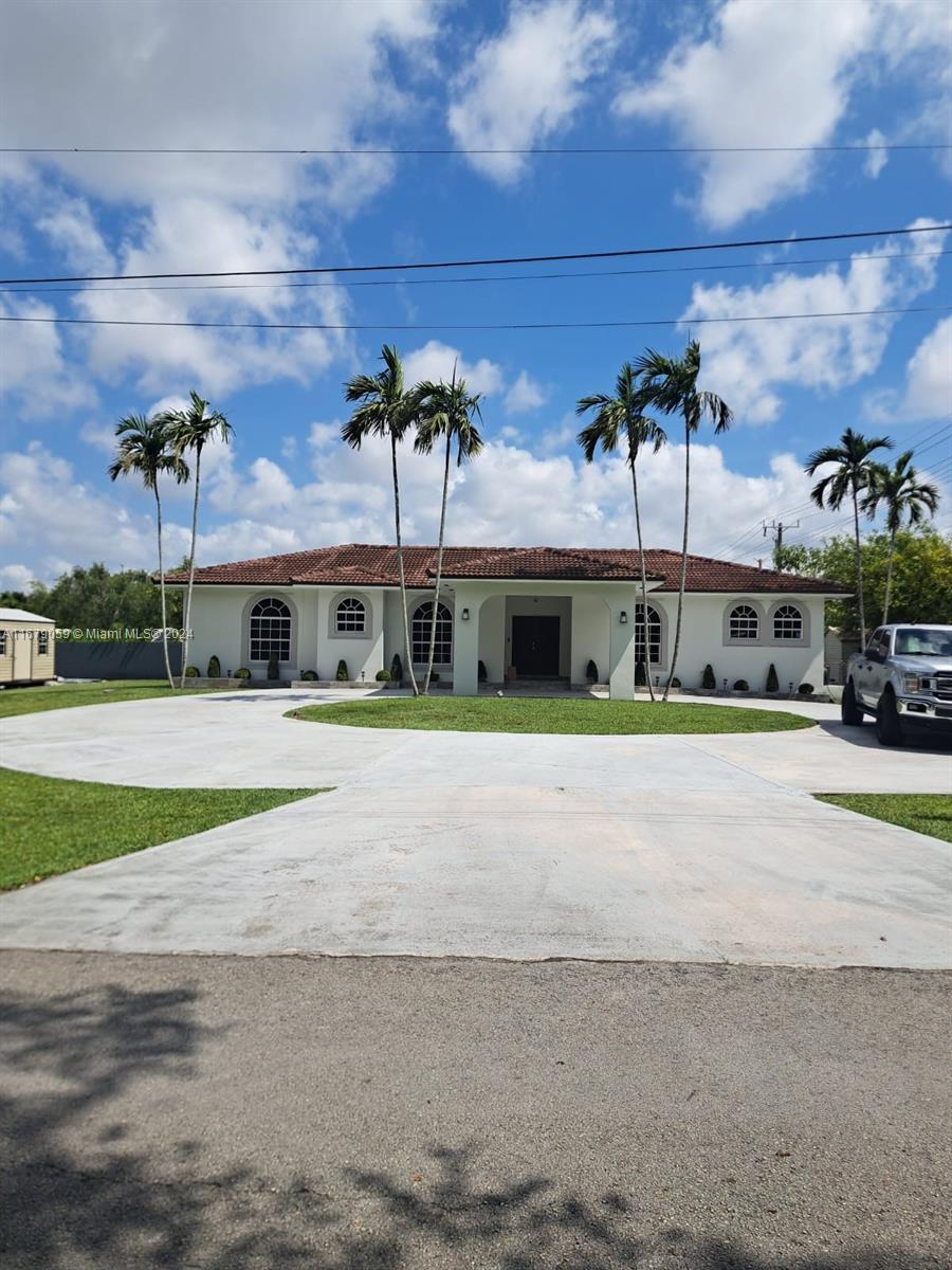 a view of house with a street