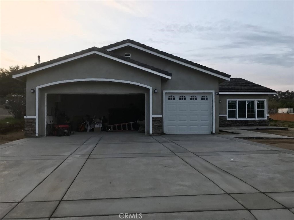 a front view of a house with yard