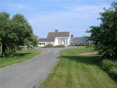 a view of building with river in front of it