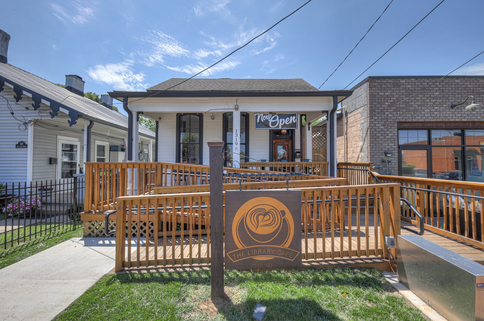 a view of a house with a wooden deck