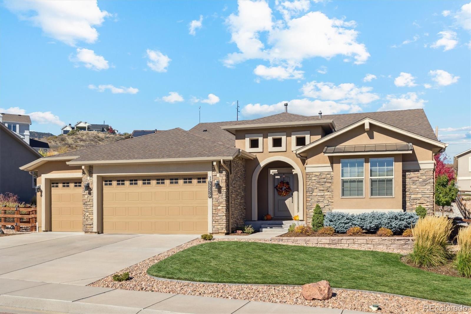 a front view of a house with a yard