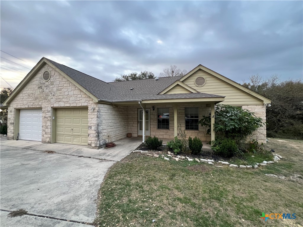 front view of a house with a yard