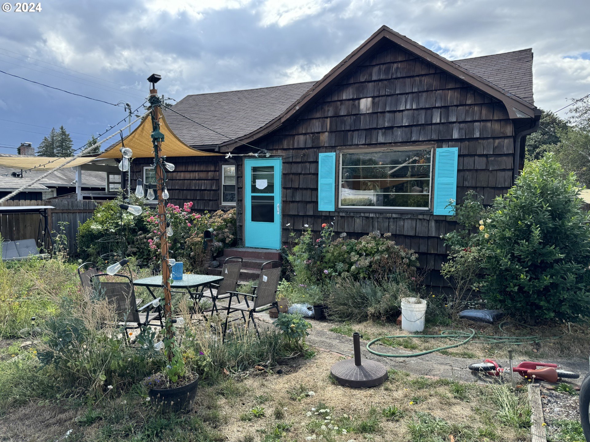 a house view with a garden space