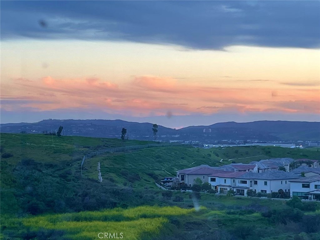 a view of a big yard with an outdoor seating a yard and mountain view