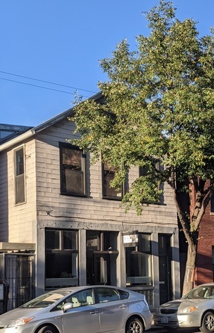 a view of a building with a tree