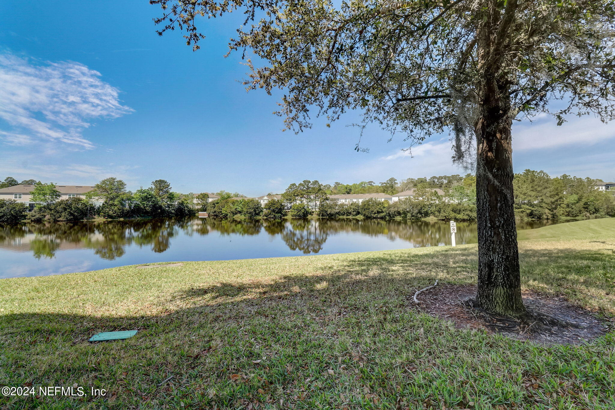 a view of lake with green space